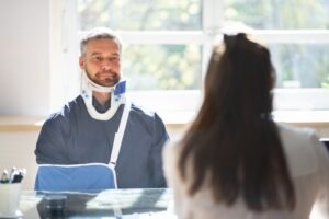 injured-man-working-with-a-personal-injury-lawyer