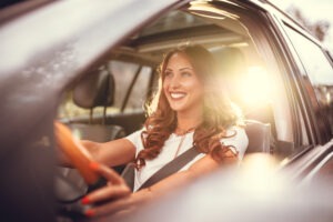 woman-at-steering-wheel-smiling