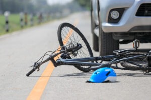 The photo depicts a bicycle accident scene in Enfield, CT. Call an Enfield bicycle accident lawyer now.