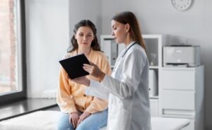doctor going over chart with patient