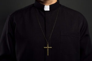 priest wearing cross