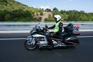 man on motorcycle on highway