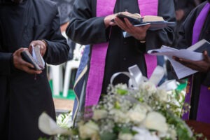 priests attending a funeral